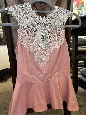 Julie’s closet cute pink peplum top! Size medium.